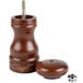 A close-up of a Fletchers' Mill Federal walnut stain wooden pepper mill with a screw.