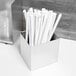 A stainless steel Vollrath straw holder with straws in it.