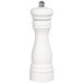 A white pepper mill with a silver top.