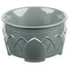 A sage green Dinex insulated bowl with a carved design.