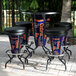 A University of Florida Gators LED pub table with four stools on a patio.