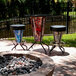 A Holland Bar Stool United States Marine Corps pub table with three bar stools on a patio.