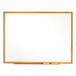 a white board with a wooden frame