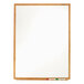 A Quartet melamine whiteboard with an oak finish.