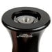 A close up of a Fletchers' Mill black metal pepper mill.