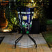 A metal bar height pub table with a University of Notre Dame logo on it.