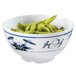 A close up of a blue and white GET Water Lily melamine bowl filled with green beans.