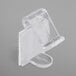 A close up of a Snap Drape clear plastic table skirt clip.