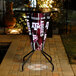 A Texas A&M logo on a lighted round bar height table.