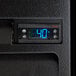 A digital display on a black Beverage-Air back bar refrigerator.