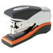 A black and orange Swingline Optima stapler.