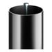 A black cylinder with a metal rod inside.