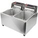 A Cecilware electric countertop deep fryer with two stainless steel pans.