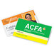 A woman smiling and holding two laminated ID badges with business card inserts.