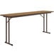 A brown rectangular Correll seminar table with black metal legs.