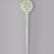 A white plastic disc pick with green writing that says "Spirit"