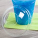 a blue drink in a plastic container