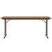 A medium oak rectangular Correll seminar table with off-set black legs.