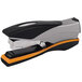 A close-up of a black and orange Swingline Optima 40 stapler.