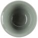A close-up of a white Cambro insulated bowl with a green interior.