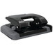 A black and gray Swingline SmartTouch 2 hole punch on a counter.