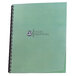 A close-up of a green folder with a clear Swingline GBC binding system cover over a sales proposal.