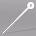 A white stick with a white disc at the end.