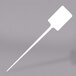A white plastic stick with a white rectangular tip.