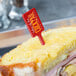 A sandwich with a WNA Comet red rectangular pick in it.