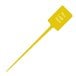 A yellow plastic rectangular pick with white text that reads "Spirit"