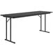 A black rectangular Correll seminar table with off-set metal legs.