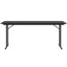 A black rectangular Correll seminar table with off-set metal legs.