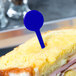 A sandwich with a blue plastic toothpick in it.