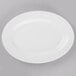 A white Libbey porcelain platter with a white rim on a gray surface.