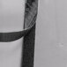 A black and white Curtron C-50 Caser display cooler strip curtain with black velcro tape.