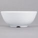 A close up of a white Tablecraft ramekin with a white rim.