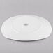 A white Libbey porcelain coupe plate with a circular design on it.