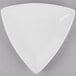 A white Libbey triangular porcelain plate.