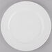A Libbey Porcelana white porcelain plate with a wide white rim.