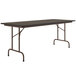 A rectangular walnut light duty melamine folding table with a metal frame.