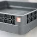 A grey plastic container with a handle and holes holding Taylor TempRite dishwasher test labels.