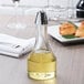 A Tablecraft oil cruet on a table.
