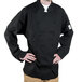 A man wearing a black Chef Revival chef coat.