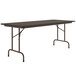 A walnut Correll rectangular folding table with a metal frame.