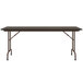 A Correll walnut rectangular folding table with a metal frame.