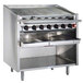 A stainless steel MagiKitch'n charbroiler with open base and four burners.