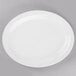 A white Libbey porcelain platter with a white rim on a gray surface.