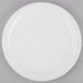 a white plate on a gray surface