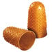 A close-up of a brown container with a pair of small amber rubber Swingline finger tips inside.