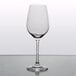 A clear Stolzle white wine glass on a table.